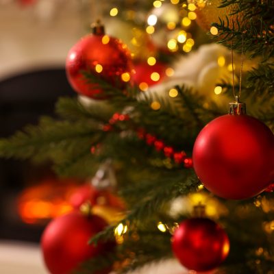 Christmas tree with beautiful decor indoors, closeup. Space for text